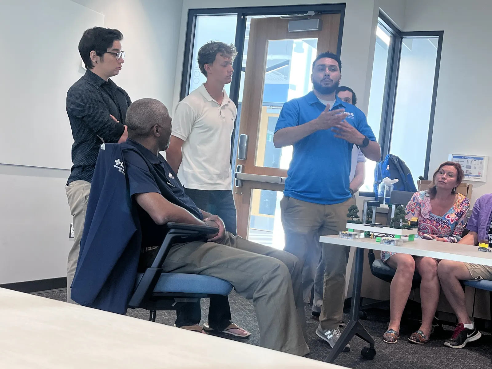 A member speaks to the group while others listen